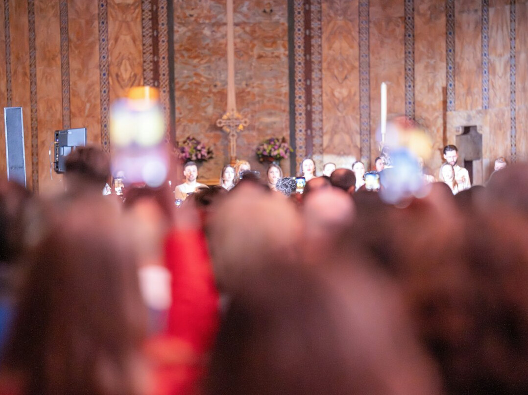 Audience listening to a speaker at a conference