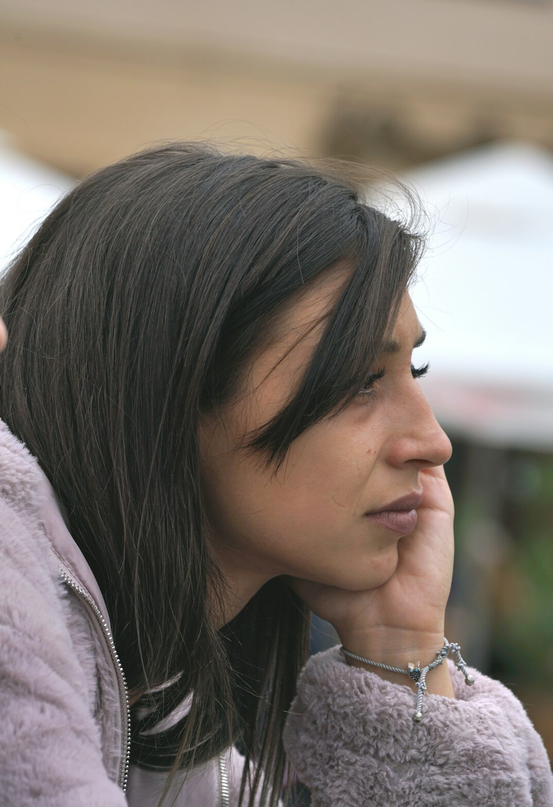 Portrait of a woman with dark hair smiling softly